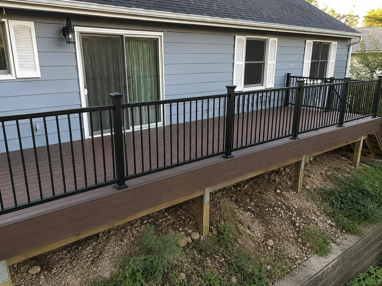 Finished TimberTech deck with stairs, fascia, borders, and railing integration
